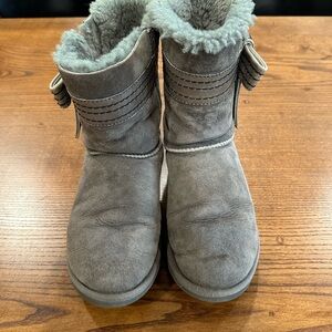 Gray UGG Suede Boots with Fur Lining and decorative leather bow.